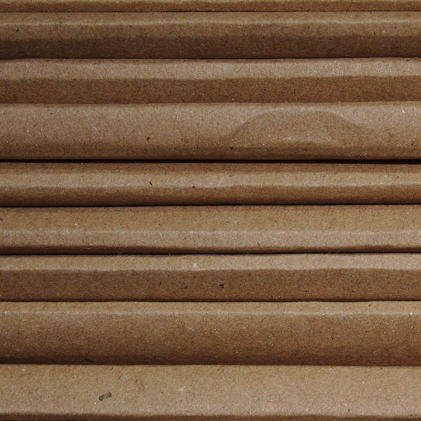 Crew unboxing delivery with cardboard packaging ready for recycling